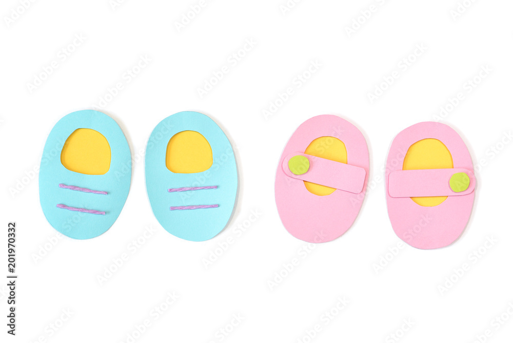 Baby shoes paper cut on white background - isolated Baby shoes paper cut on white background - isolated