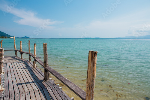 Paradise beach with wooden bridge © Smile