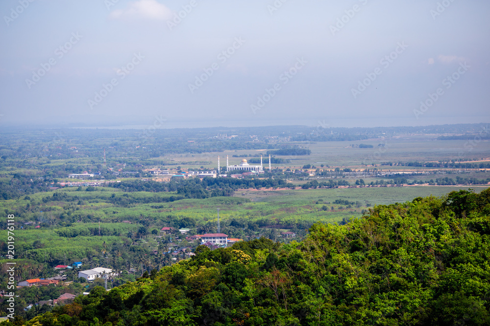 on hill top viewpoint and doing finger frame for crop the sun at sunset time, Hatyai viewpoint, Songkhla, Travel in Thailand, Summer holiday vacation travel trip