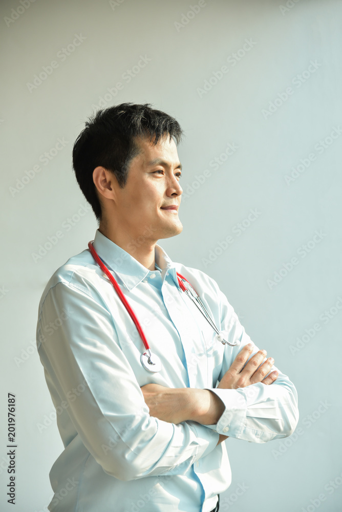 Portrait of Young Asian male Doctor is smiling. Portrait of Young Asian male Doctor is smiling.