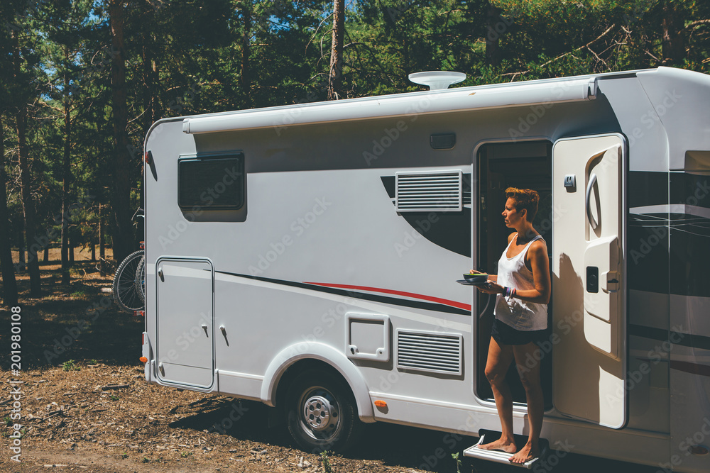 Girl has meal on a motor home Girl has meal on a motor home