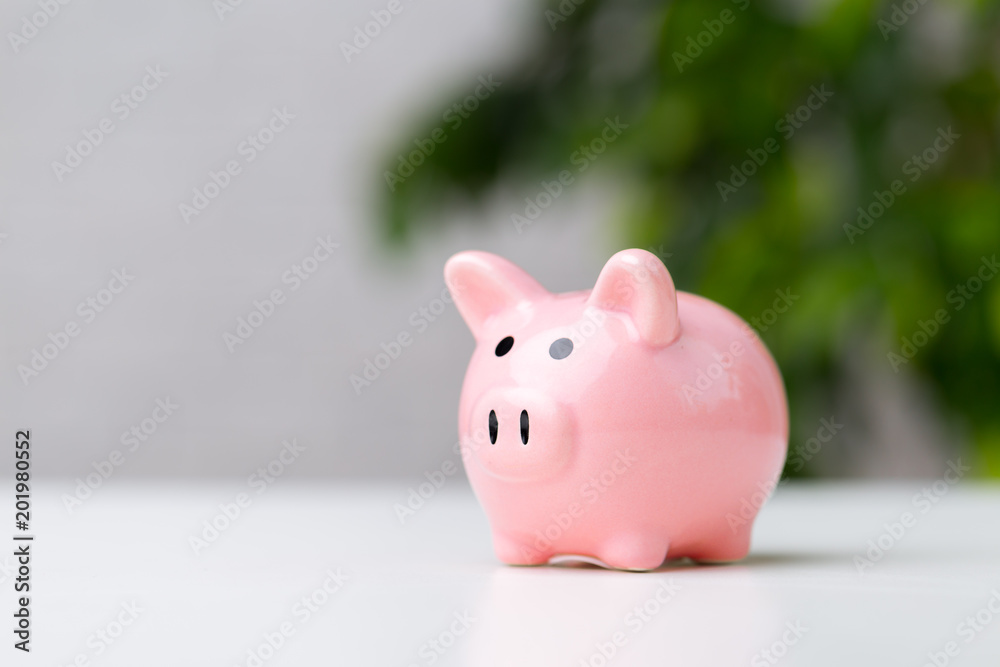 Piggy bank on table with copy space Piggy bank on table with copy space