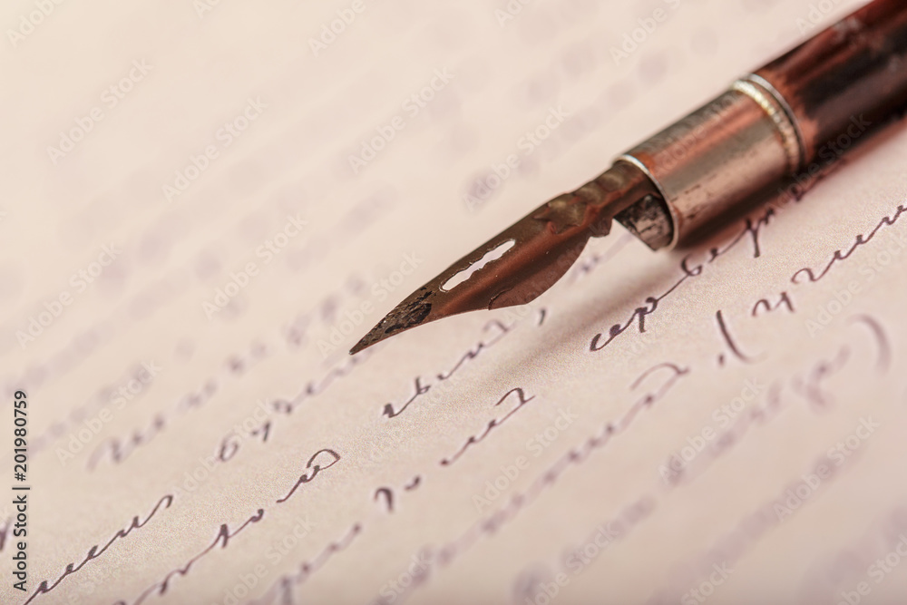 Fountain pen on an antique handwritten letter Fountain pen on an antique handwritten letter