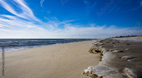 Montauk, USA - circa January 2018: lonely and almost eternal beach horizon on a winter morning on Long Island