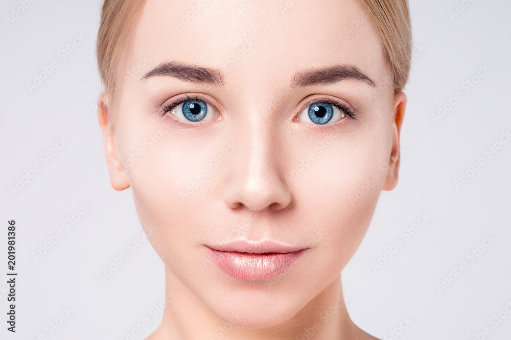 Woman beautiful face portrait. Beauty Portrait. Beautiful Spa model Girl with Perfect Fresh Clean Skin. Blonde female looking at camera. Youth and Skin Care Concept. Woman beautiful face portrait. Beauty Portrait. Beautiful Spa model Girl with Perfect Fresh Clean Skin. Blonde female looking at camera. Youth and Skin Care Concept.