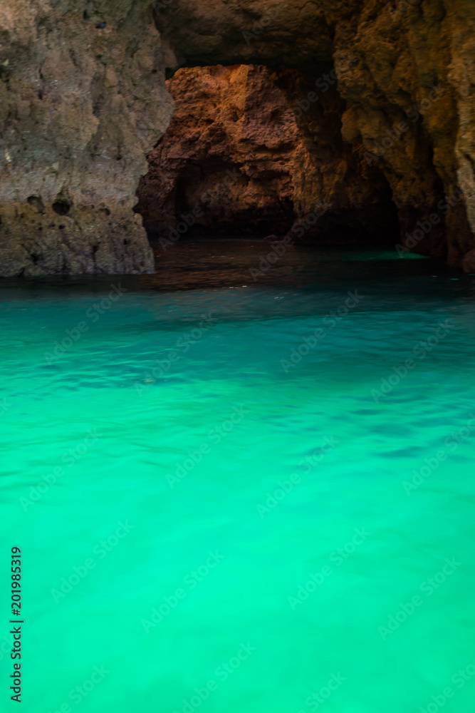 Lagos Caves and Seashore with its Esmerald Water. Exposure done in a boat tour in the Lagos seashore, Algarve, Portugal