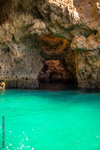Lagos Caves and Seashore with its Esmerald Water. Exposure done in a boat tour in the Lagos seashore, Algarve, Portugal © Paulo