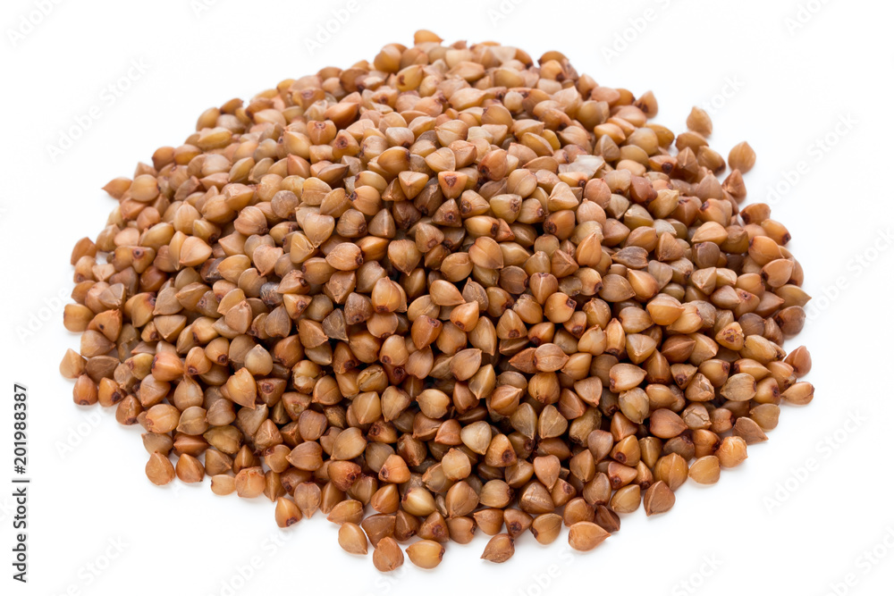 Buckwheat grains isolated on the white background. Buckwheat grains isolated on the white background.