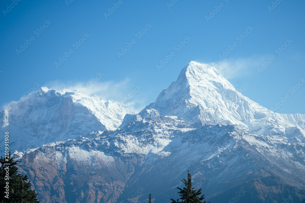 Obraz premium beautiful view of the landscape of the Himalayan mountains. Snow-covered mountain peaks. trekking concept in the mountains