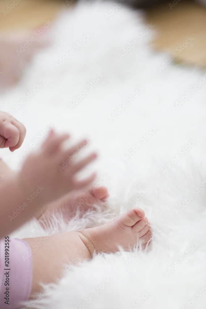 baby feet on white blanket. copy space. selective focus baby feet on white blanket. copy space. selective focus