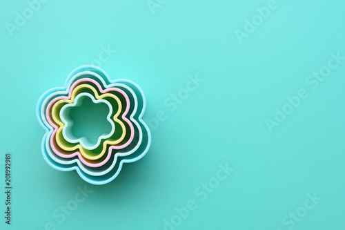 Close up of flower shaped of dessert plastic mold in multi color for background