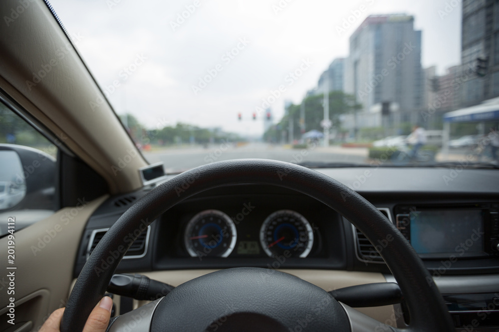 Driving car on city street wating infront of the traffic light Driving car on city street wating infront of the traffic light