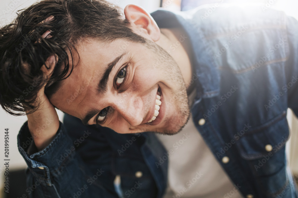 young fashioned sitting smiling