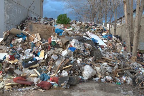 Heap of municipal garbage and trash at the side of the road, 