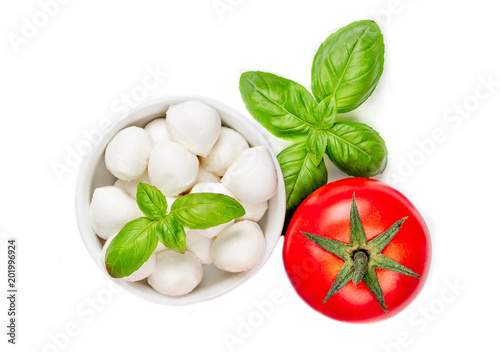 Fresh  Salad  Ingredients with Mozzarella cheese, tomatoes, basil and spices isolated on white background. Food concept. Topp view.