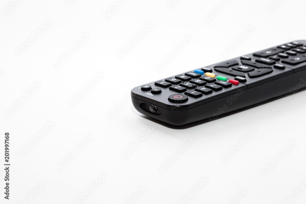 Remote control with a set of numbers lies on a white background. Enlarged image with space for writing text. Remote control with a set of numbers lies on a white background. Enlarged image with space for writing text.