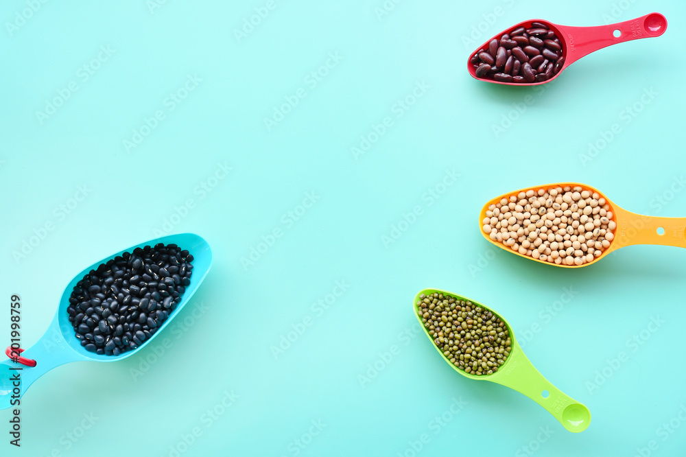 Assortment of beans in spoon for background Assortment of beans in spoon for background