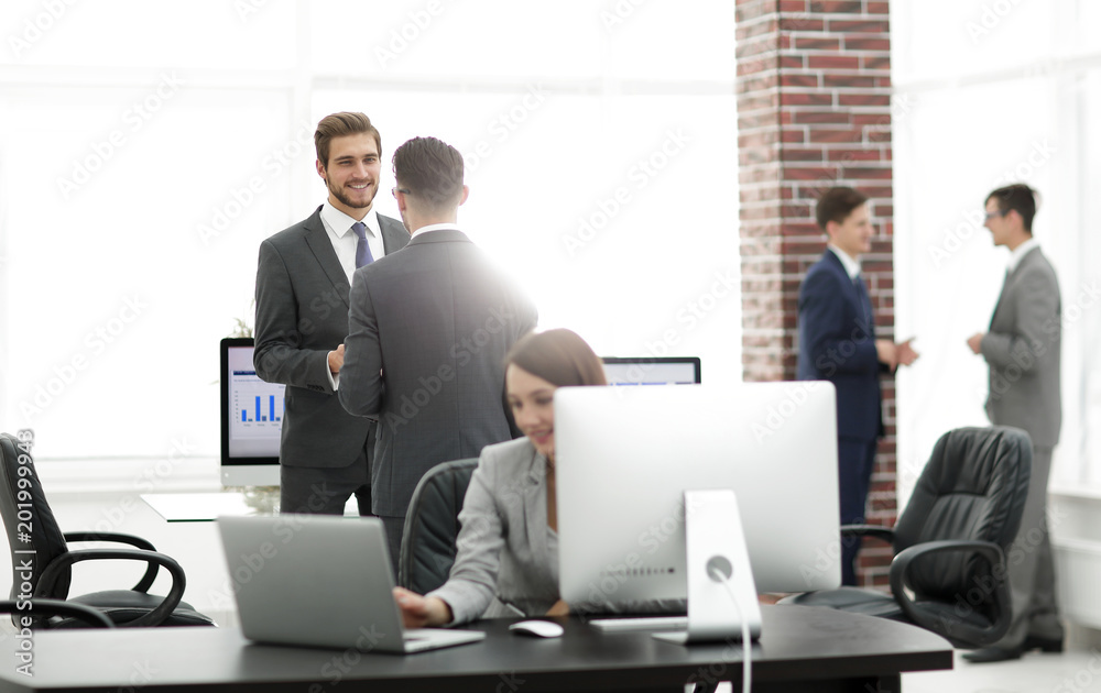 Group of business partners interacting during break Group of business partners interacting during break