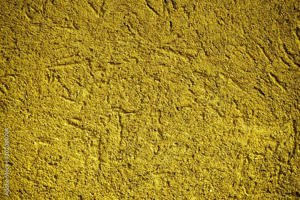 Ultra yellow Plaster concrete texture, stone surface, rock cracked background for postcard