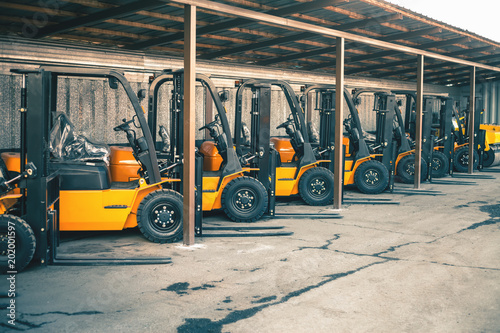Background of a lot of forklifts, reliable heavy loader, truck photo