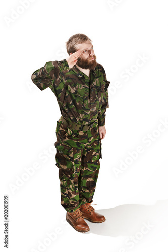 Young army soldier wearing camouflage uniform isolated on white