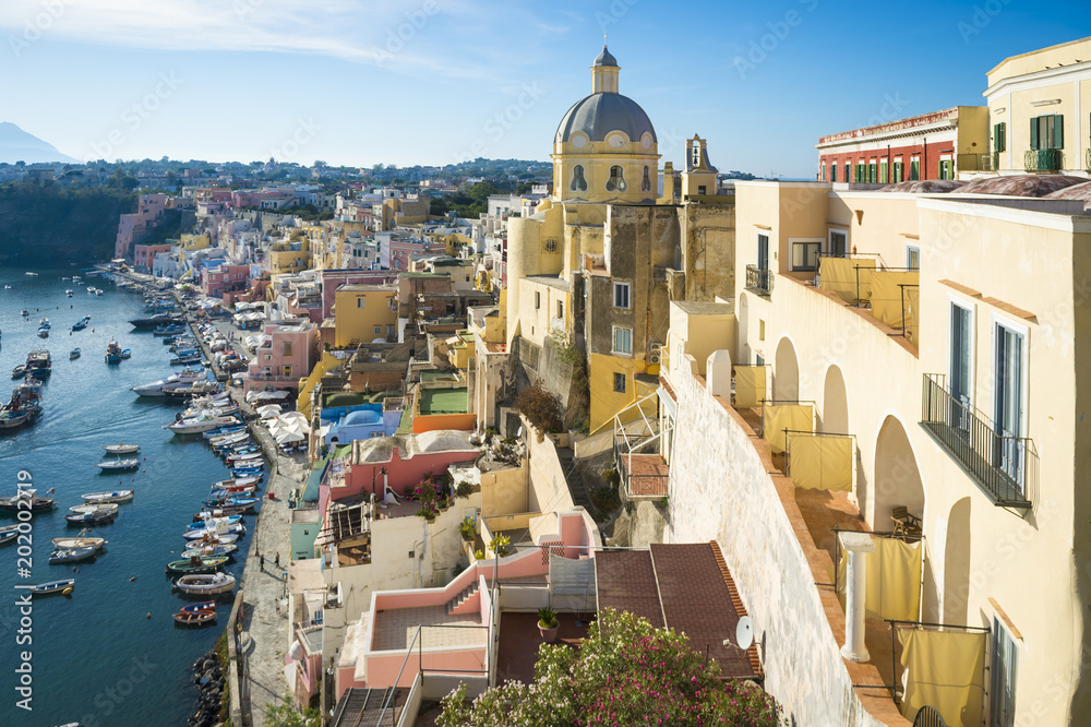 Scenic late afternoon view of the picturesque Italian village of Corricella on the island of Procida in the Bay of Naples.
