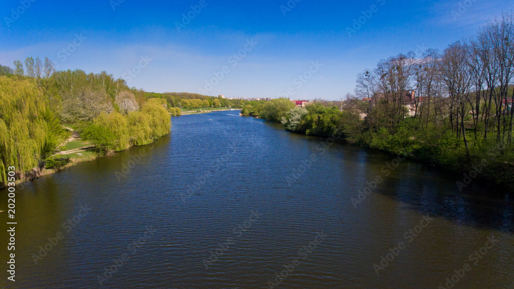Aerial view of lake in the city. Spring time.