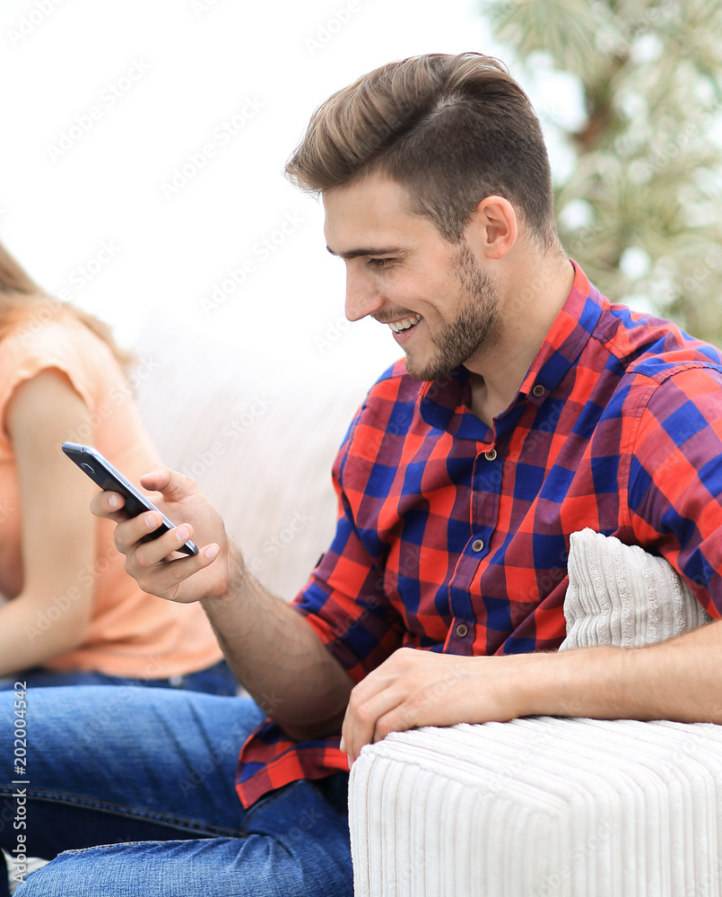 group of young people resting on the couch in the living room. group of young people resting on the couch in the living room.