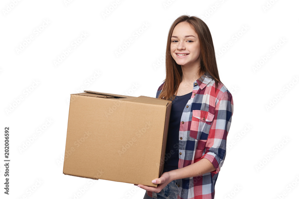 Delivery, relocation and unpacking. Smiling young woman holding cardboard box isolated on white background