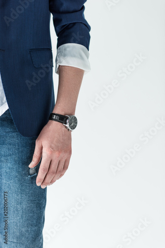 Close-up view of watch on male hand isolated on light background