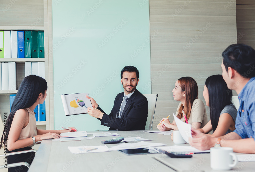 Manager holding papers hands and Smiling Professional team of coworlcers making great business discussion in modern office teamwork people. Manager holding papers hands and Smiling Professional team of coworlcers making great business discussion in modern office teamwork people.