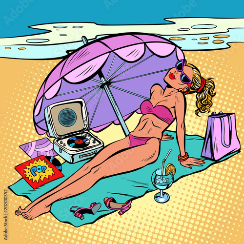 Beautiful woman in bikini sunbathing on the beach