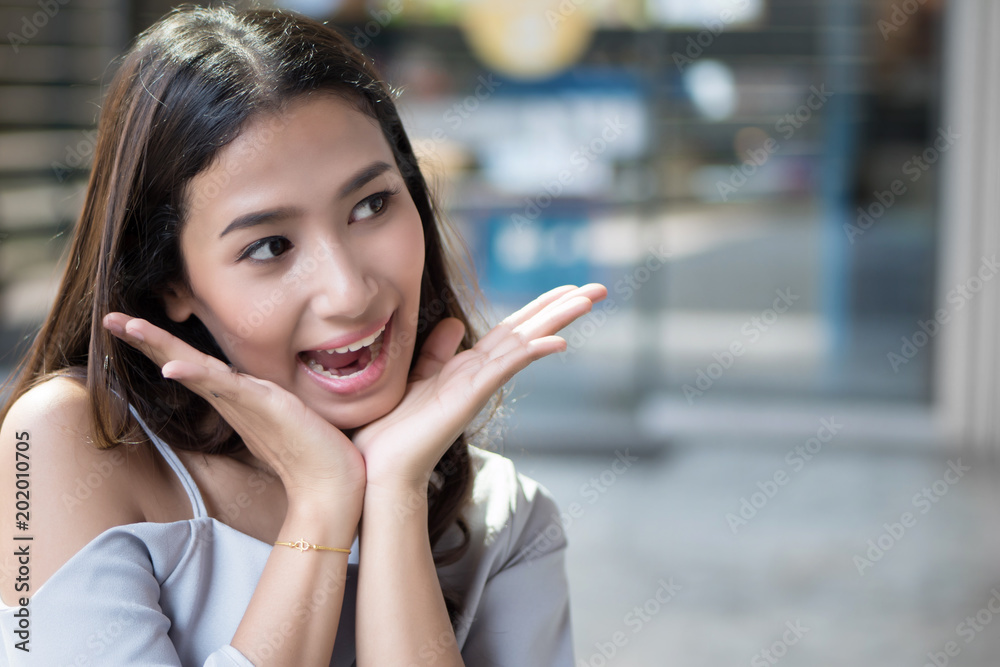 excited woman looking up with surprise and interest; portrait of surprised, excited asian woman with exciting, oh, uh, ah, wow interesting face expression; asian young adult woman model excited woman looking up with surprise and interest; portrait of surprised, excited asian woman with exciting, oh, uh, ah, wow interesting face expression; asian young adult woman model