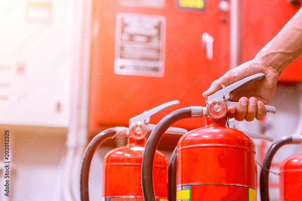Close up Fire extinguisher and pulling pin on red tank. Close up Fire extinguisher and pulling pin on red tank.
