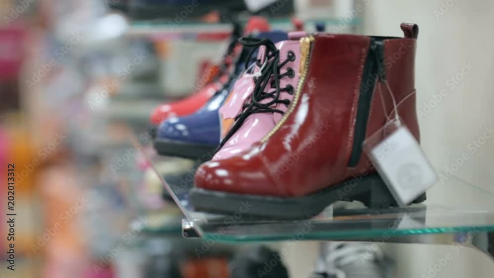 Boots on shelves at shoe store Boots on shelves at shoe store