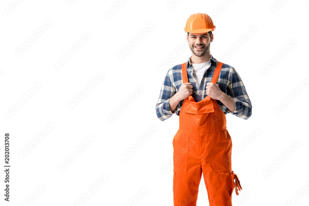 Smiling repairman in orange overall and hard hat isolated on white