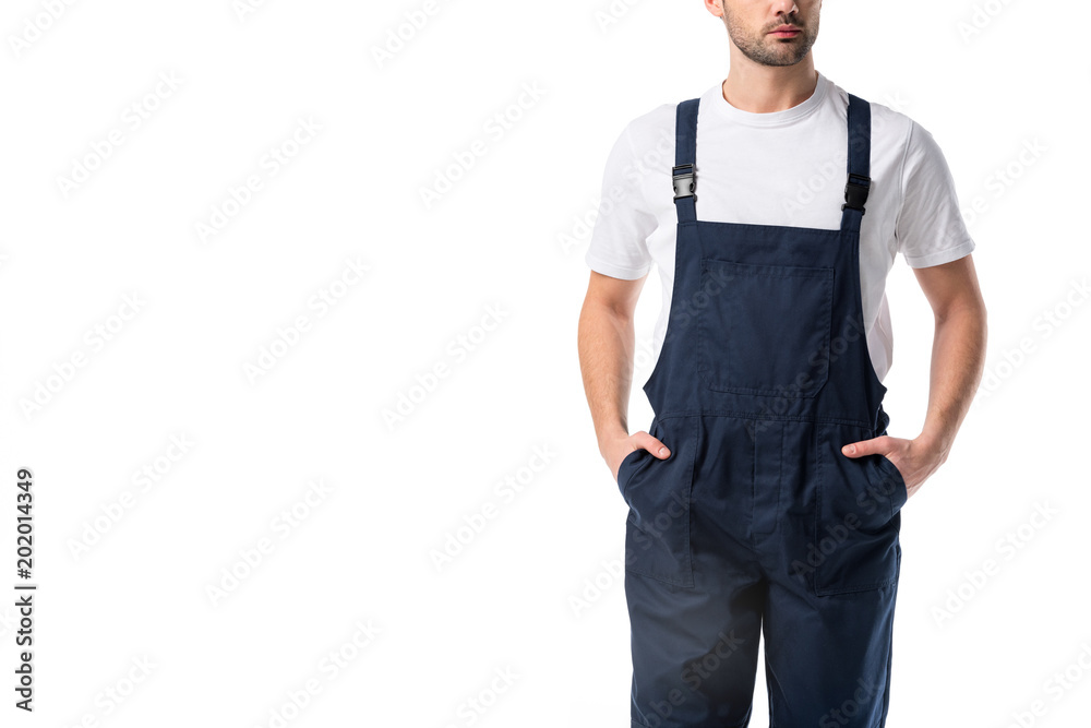 partial view of cleaner in uniform with hands in pockets isolated on white
