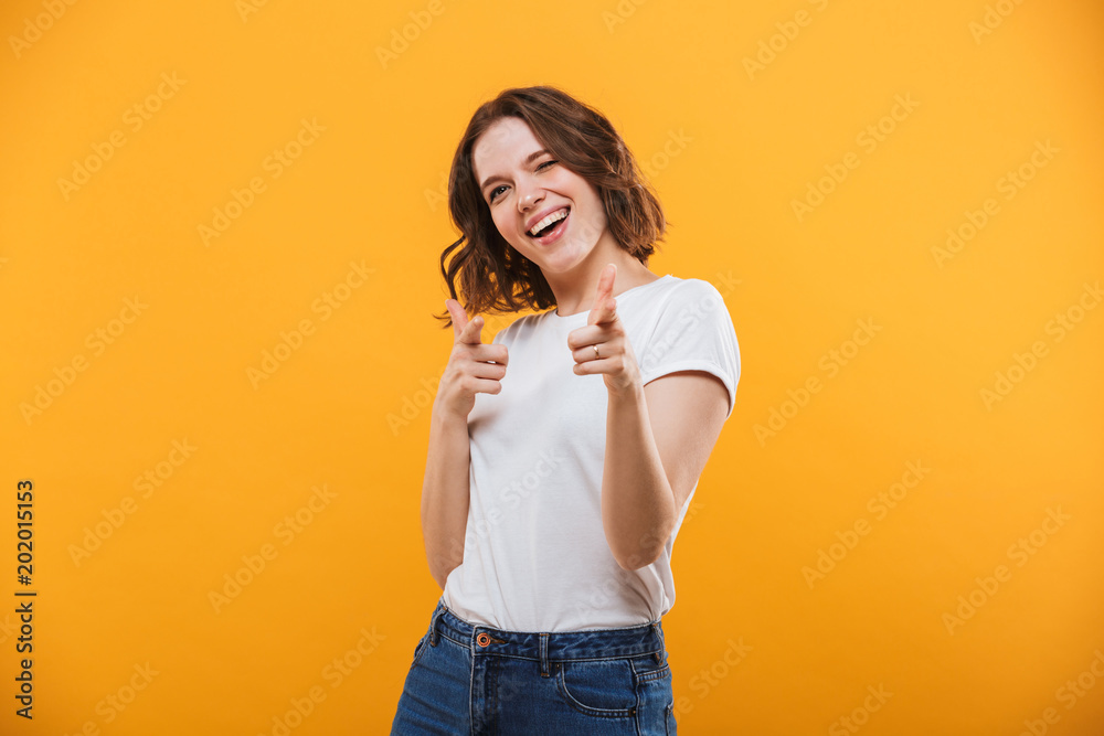 Happy emotional young woman pointing to you. Happy emotional young woman pointing to you.