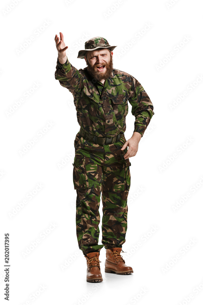 Young army soldier wearing camouflage uniform isolated on white Young army soldier wearing camouflage uniform isolated on white