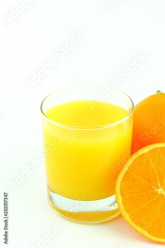 glass of orange juice and fresh orange fruits isolated on a white background with copy space