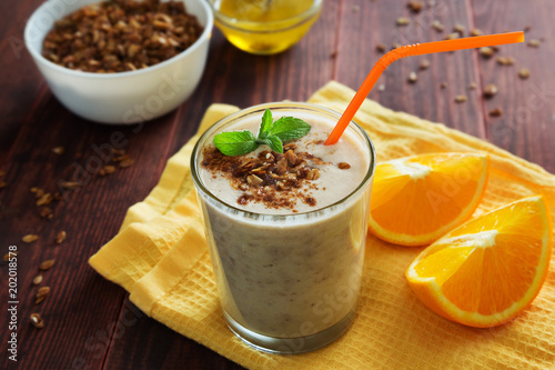 Orange milkshake with granola and mint