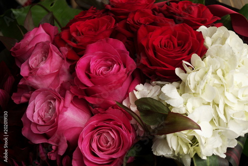                                                              - Red and pink roses in flower arrangement