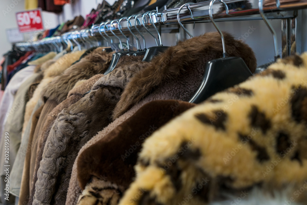 Rail of Secondhand Fur Coats For Sale in a Thrift Store Shop Stock Photo |  Adobe Stock