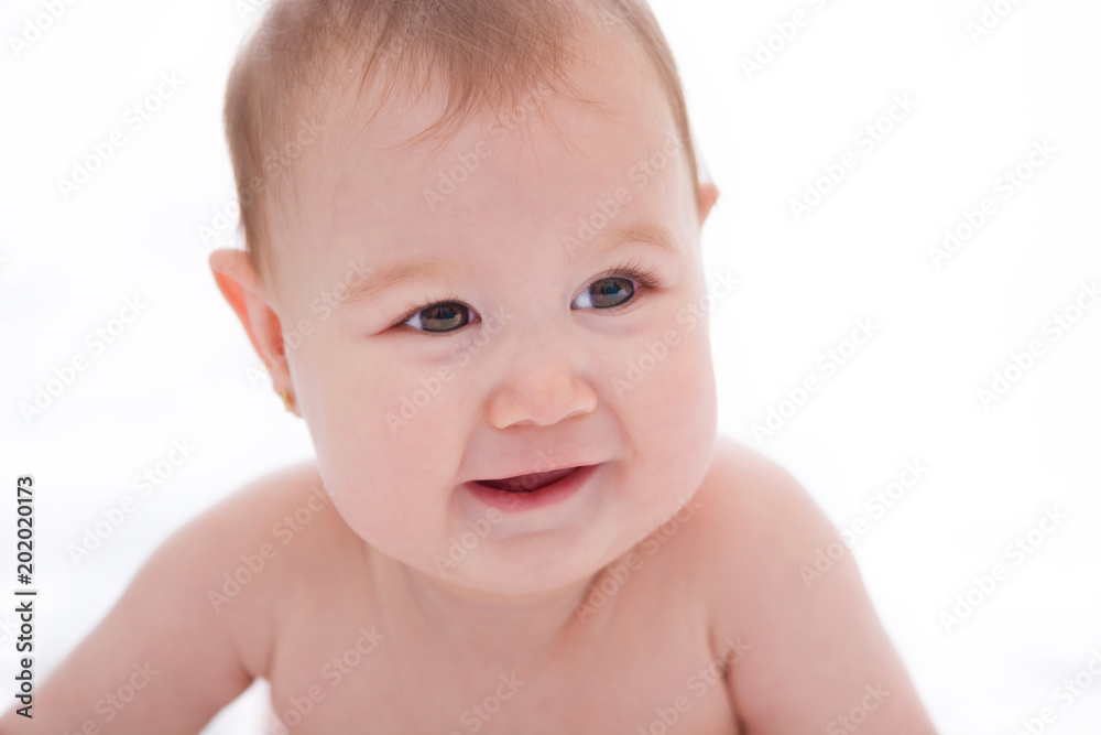 Adorable little baby girl smiling on white background. Adorable little baby girl smiling on white background.