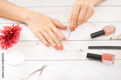 Women s hands with tools for manicure. Nail care.