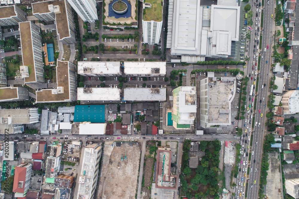 Top view aerial view of modern condominium building with house and flat