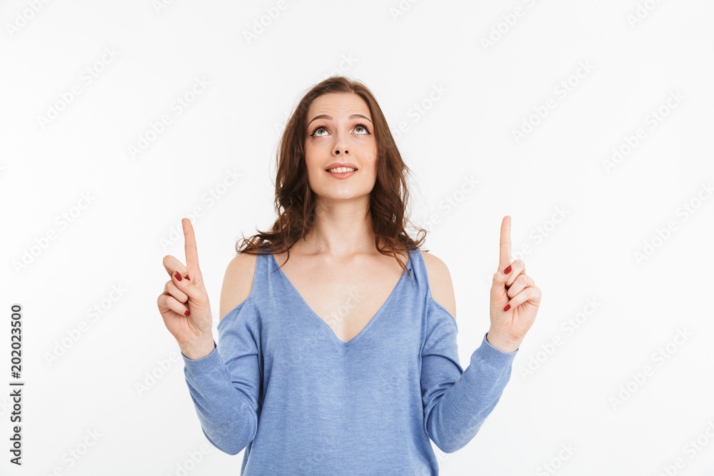 Portrait of a smiling young woman pointing Portrait of a smiling young woman pointing