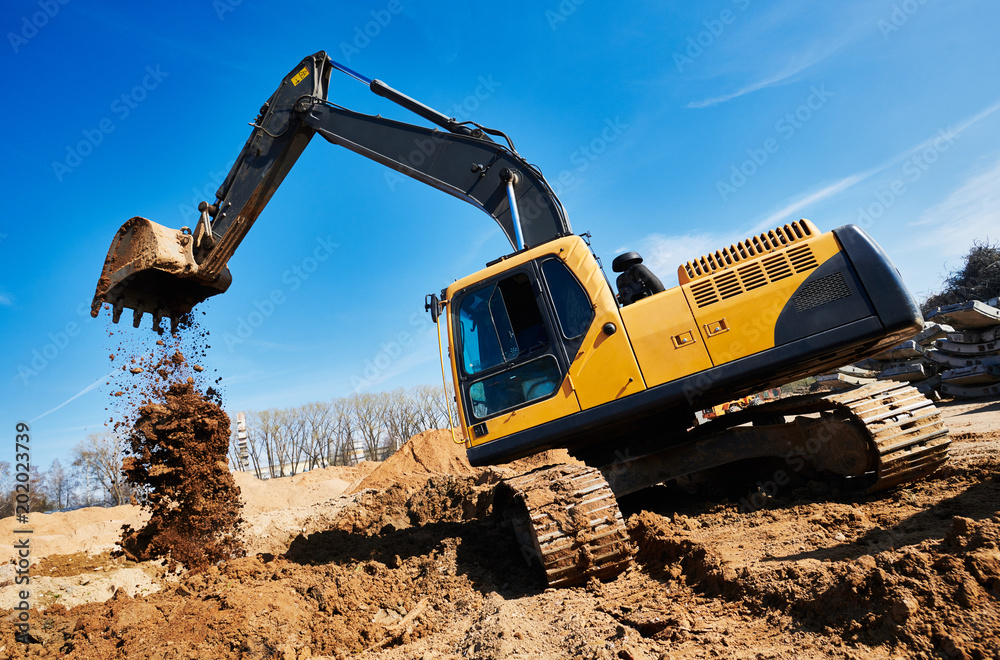 Obraz premium excavator loader machine at construction site