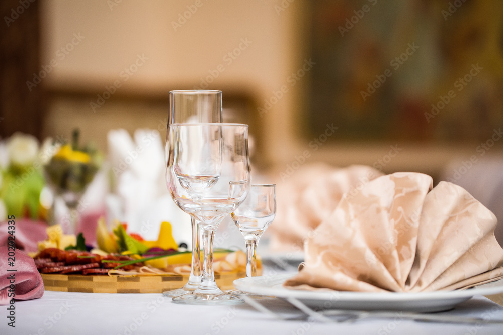 A restaurant. Celebration. Guests. Glasses. Alcohol