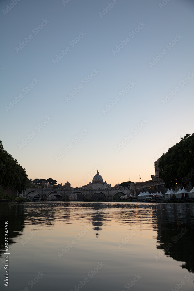 Sunset view of Tiber River and St. Peter's Basilica in Rome, Italy Sunset view of Tiber River and St. Peter's Basilica in Rome, Italy